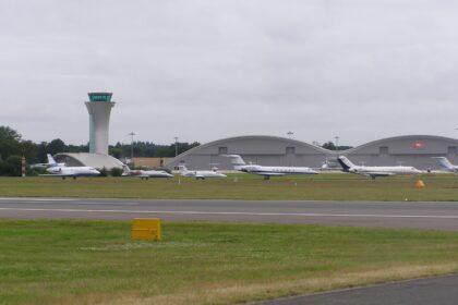 A line-up of business jets at Farnborough Airfield, England