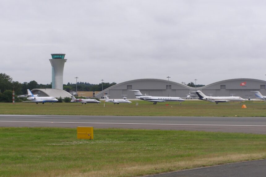 A line-up of business jets at Farnborough Airfield, England