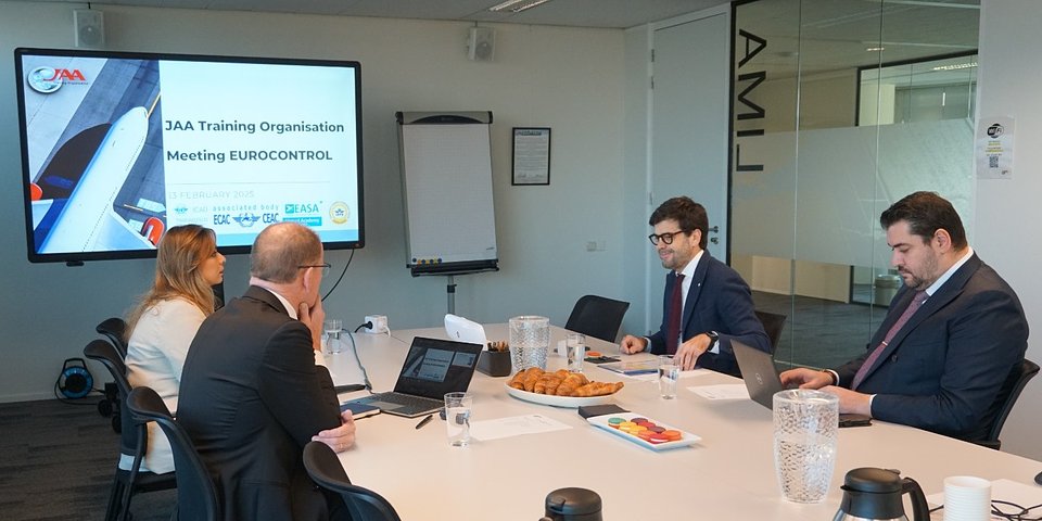 Image of a boardroom meeting with EURONCTROL and JAA TO