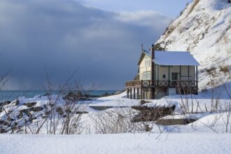 A cottage on the edge of a frozen lake in Hokkaido, Japan.