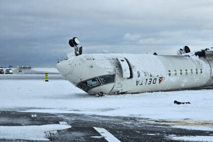 A rear image of an upside-down delta plane in a snowy weather.