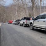 Emergency crews gather at the base of the toll road on Mount Equinox following a small plane crash.