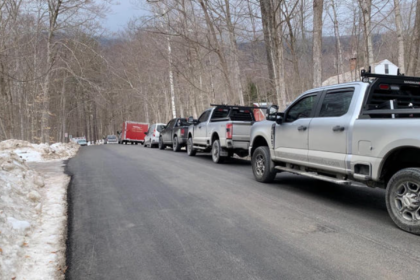 Emergency crews gather at the base of the toll road on Mount Equinox following a small plane crash.