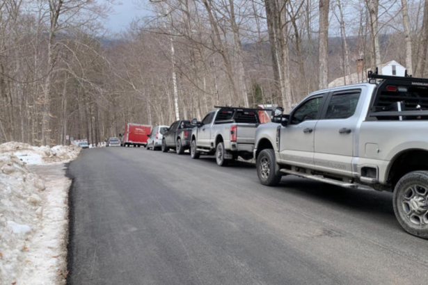 Emergency crews gather at the base of the toll road on Mount Equinox following a small plane crash.