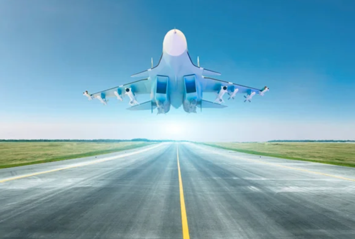 Military fighter jet flies at high speed over the taxiway at the airport © Depositphotos