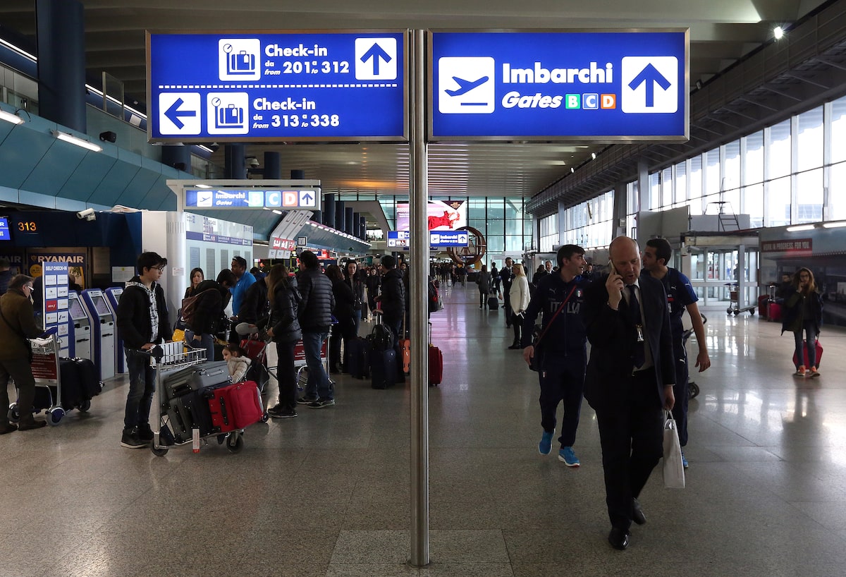  Check-in and departure gates signs are seen at the terminal at Fiumicino's International 
