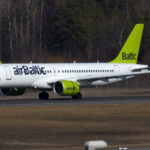 CS300 of airBaltic landing at Stockholm-Arlanda airport. 16 March 2017