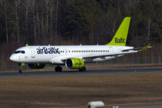 CS300 of airBaltic landing at Stockholm-Arlanda airport. 16 March 2017