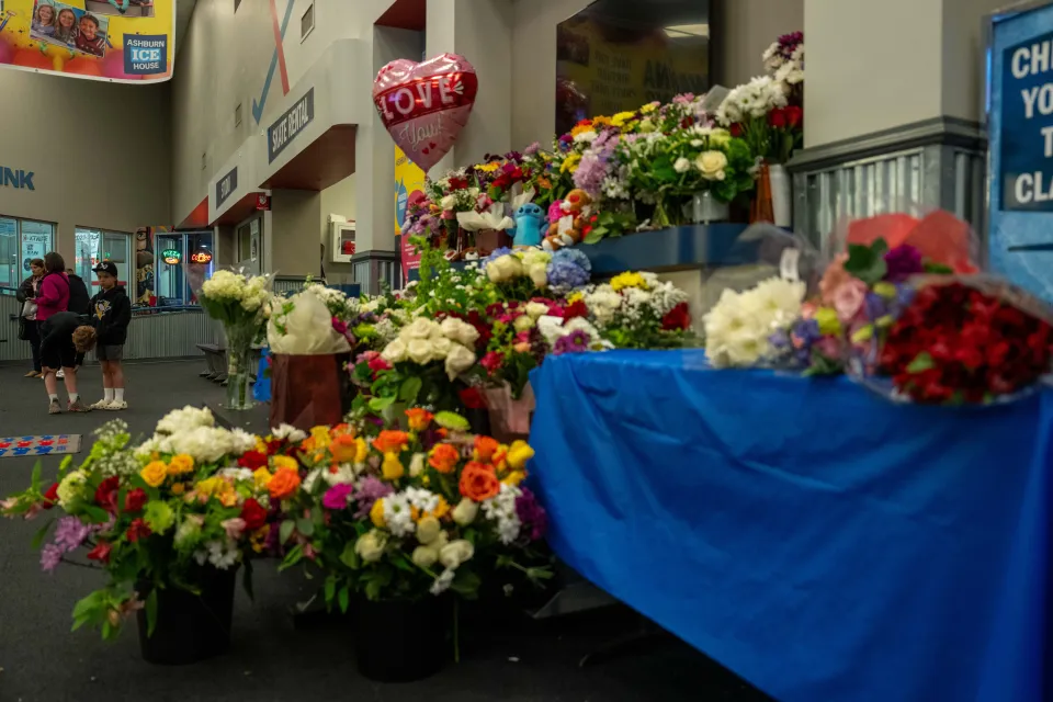 Flowers left at the Ashburn Ice House rink in Virginia for victims killed in a crash between a commercial flight and military helicopter in Washington DC 