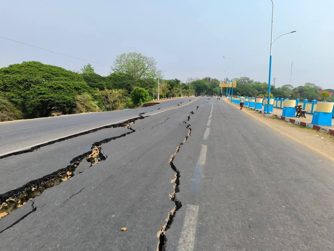 Roads cracked open following earthquake.