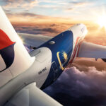 Artists rendition of a Malaysia Airlines Airbus A350-900 flying to the sunset.