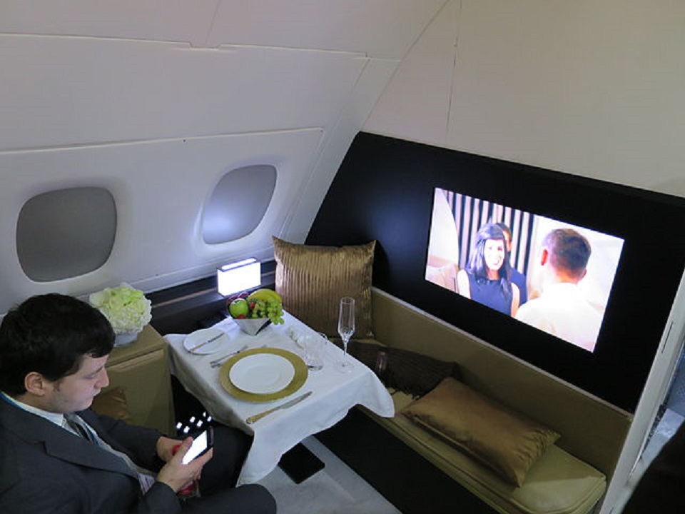 A first class Etihad Airways cabin with entertainment