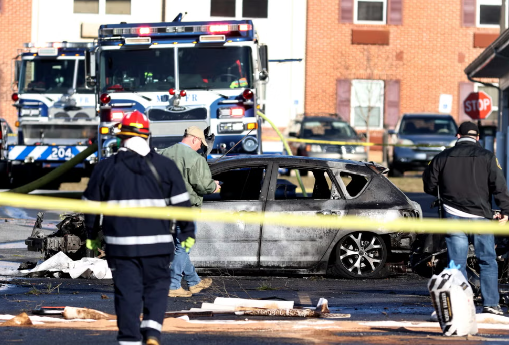 Burned out car in plane crash aftermath