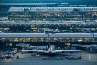 A view of an aircraft and the buildings of Heathrow Airport Terminal 5