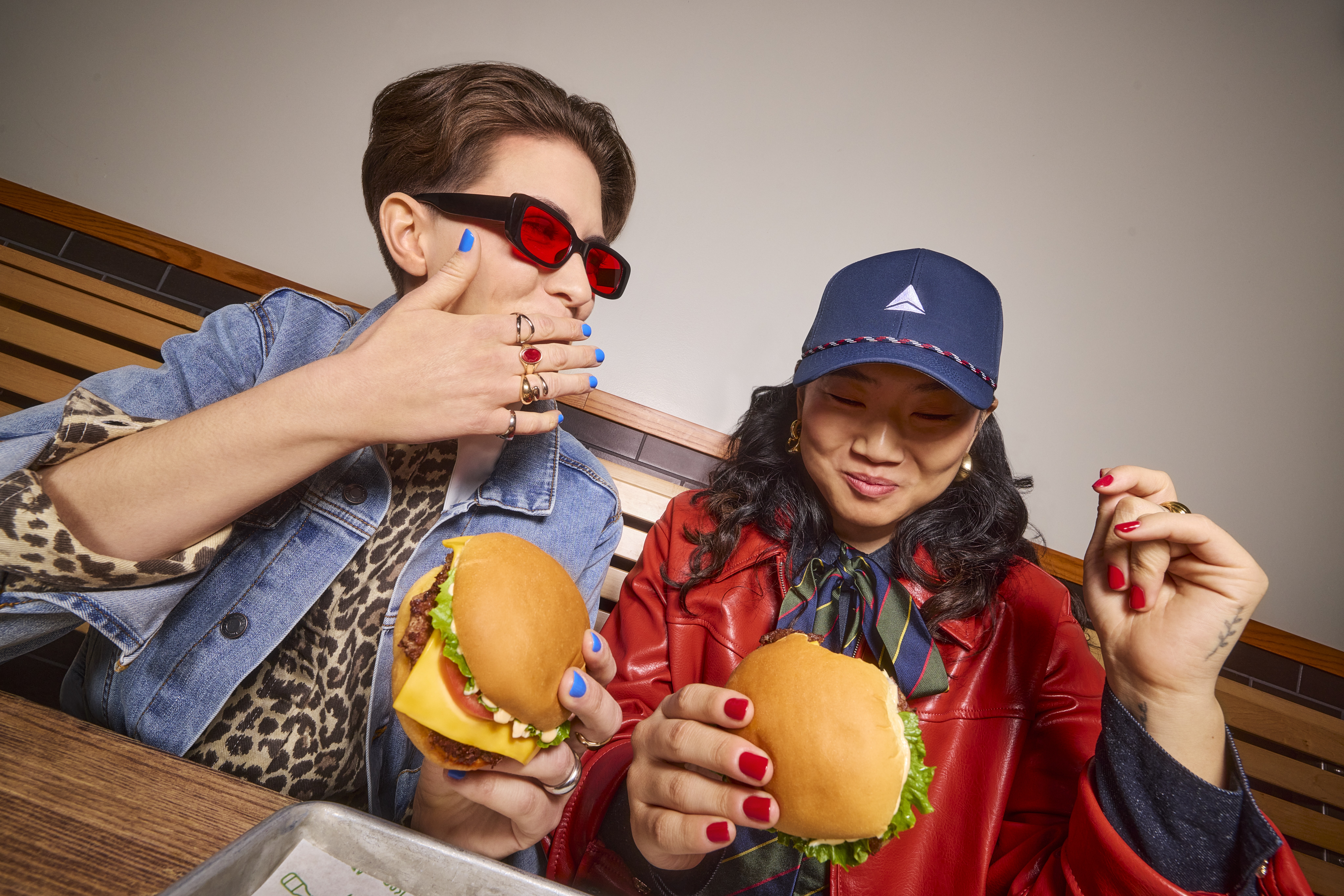 Customers enjoying an all time favourite cheeseburger.