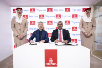 Representatives of Emirates and Trip.com signing the expanded strategic partnership.