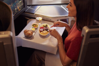 A British Airways Club World passenger enjoys a meal.