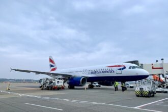 A British Airways commercial jet on the grounds of Gatwick Airport.