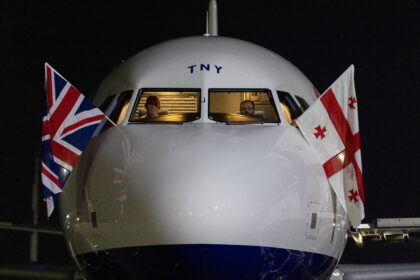 British Airways flag carrier aircraft with British Union Jack flag and Georgian flag