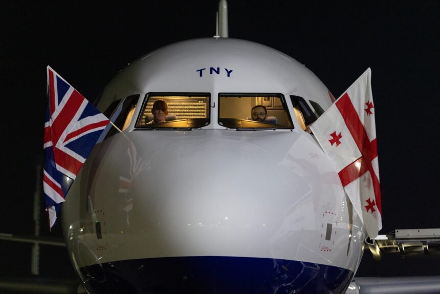 British Airways flag carrier aircraft with British Union Jack flag and Georgian flag