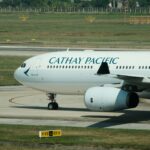 A Cathay Pacific airplane is landing.