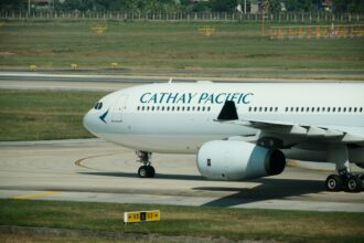 A Cathay Pacific airplane is landing.