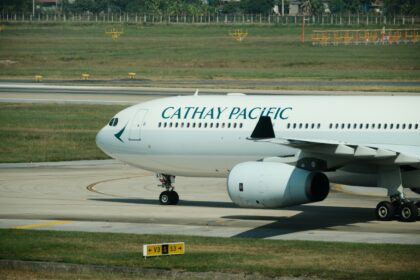 A Cathay Pacific airplane is landing.