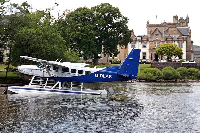 G-DLAK Cessna 208 Caravan with Cameron House Hotel in the background