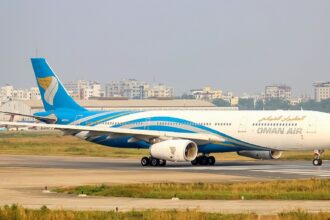 An Oman Air Airbus A330-343 on a runway
