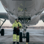 SAS ground operator inspecting the aircraft