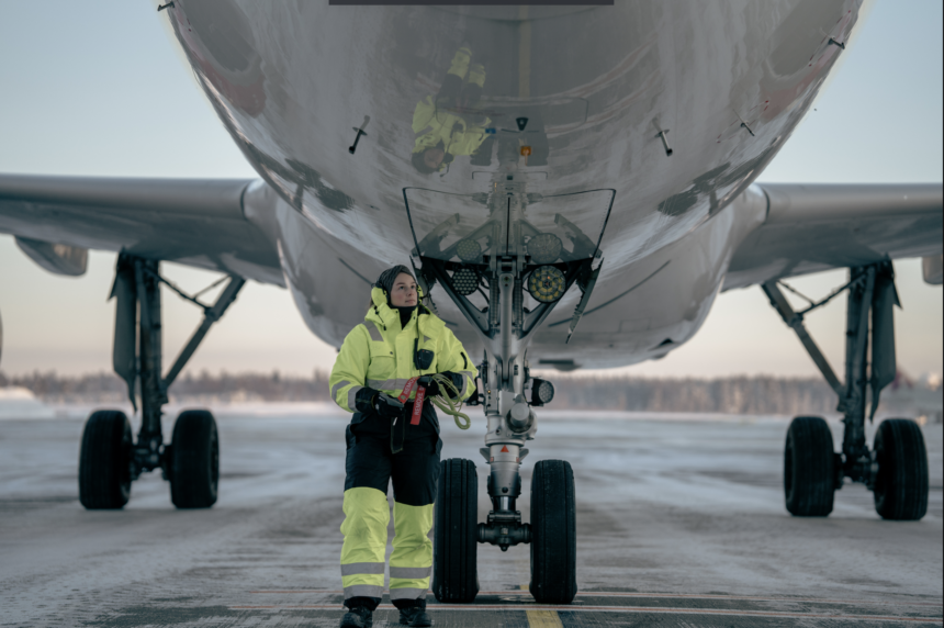 SAS ground operator inspecting the aircraft