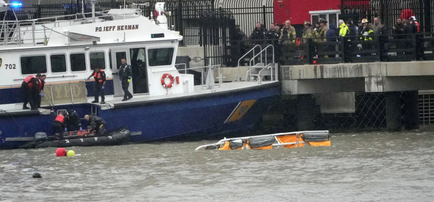 Firefighters and Police can be seen at the scene of the helicopter crash