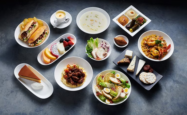 A selection of main meals, desserts and snacks offered by Emirates' in-flight menu.