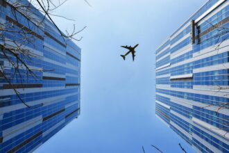Aircraft between buildings.