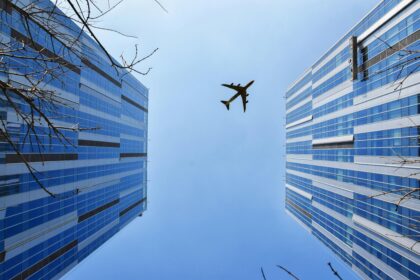 Aircraft between buildings.