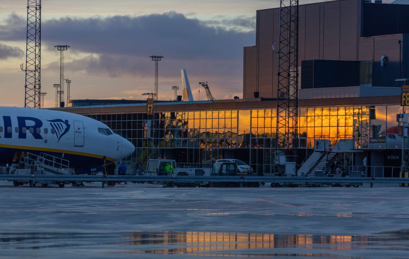 The nose of a Ryanair aircraft is seen outside a Copenhagen Airport Terminal building.