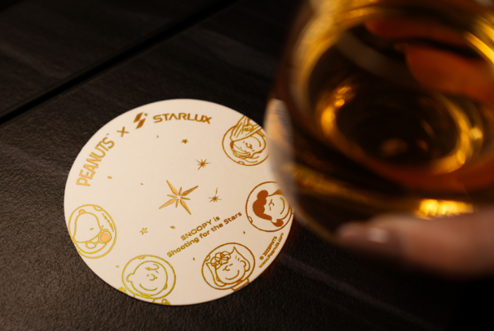 Snoopy-themed coaster available in-flight.