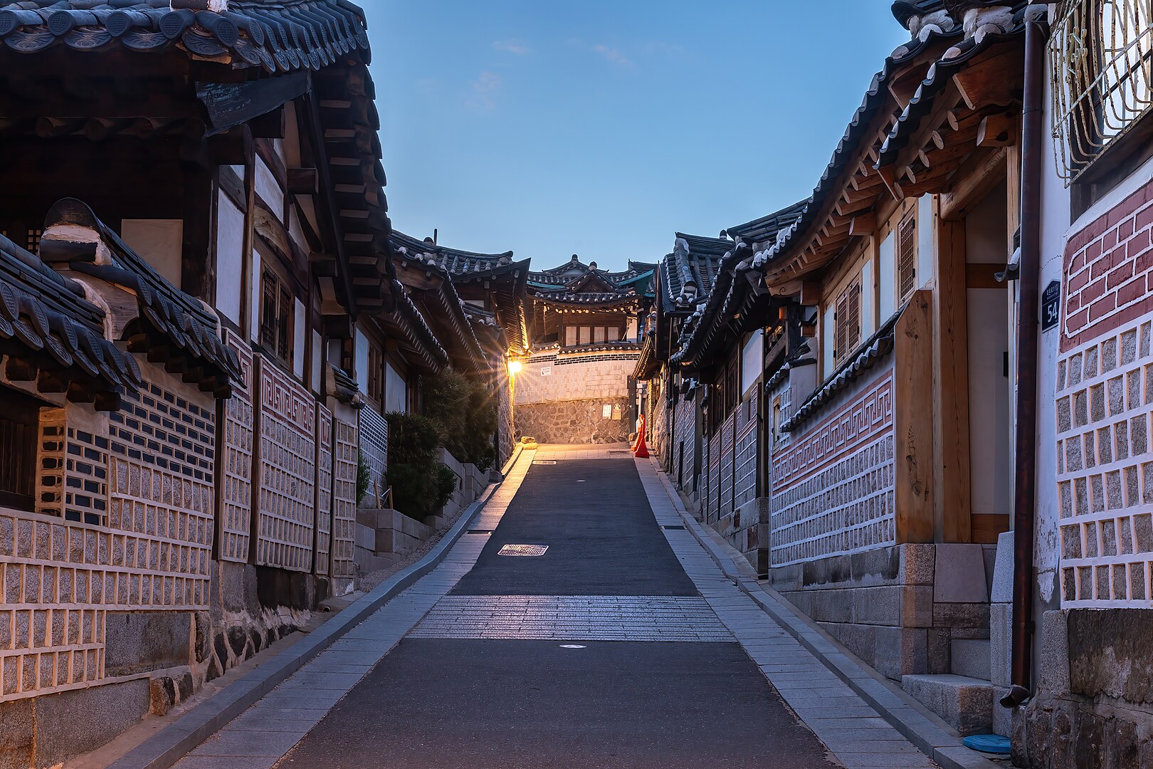 Traditional hanok houses at blue hour in Seoul.