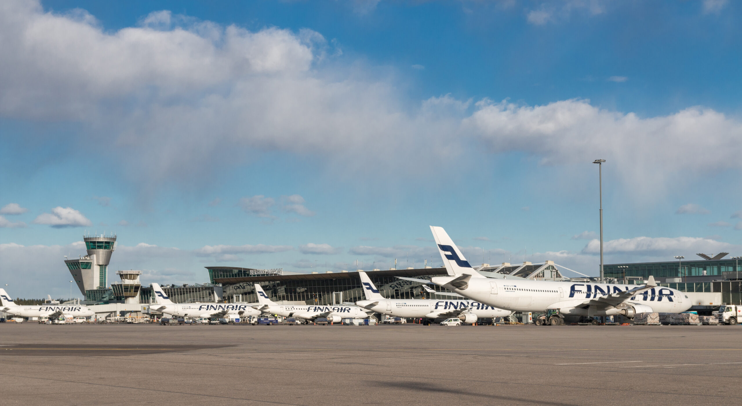 An image of a series of Finnair aircraft waiting at Helsinki Airport Terminal 2