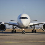 Front view of Lufthansa Airbus A350 aircraft on the runway preparing for takeoff.