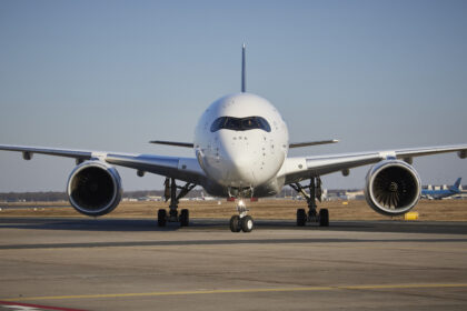 Front view of Lufthansa Airbus A350 aircraft on the runway preparing for takeoff.