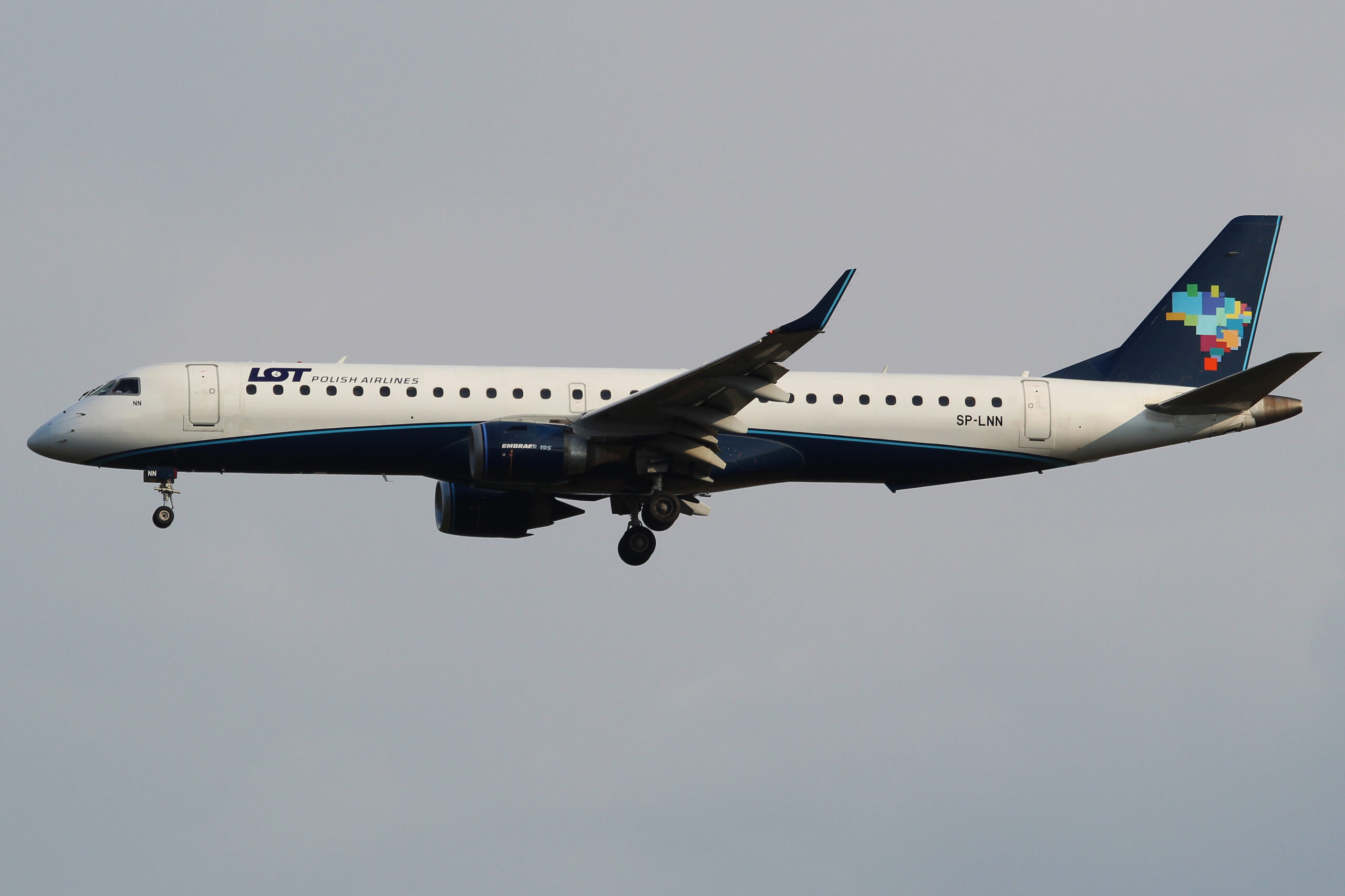 An image of a LOT Polish Airlines Embraer E195 in the air.