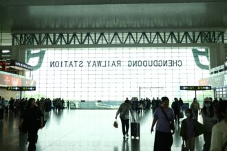 Tourists walking at an airport to show international tourist arrival