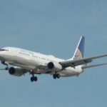 An image of a United Boeing 737-900 on approach for Harry Reid International Airport in Las Vegas, Nevada.