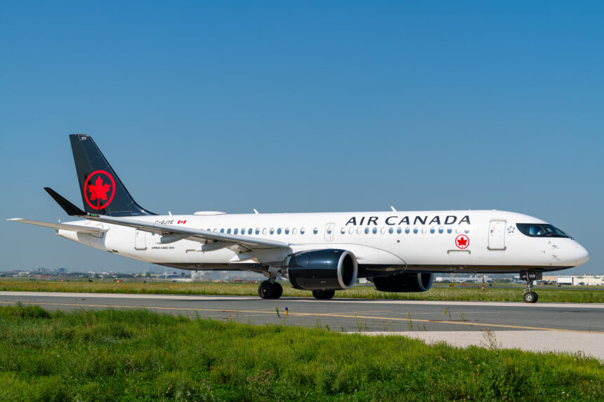 An Air Canada-operated Airbus A220 on an airport runway.