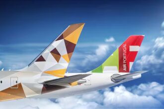Tails of Etihad aircraft and TAP Portugal aircraft.