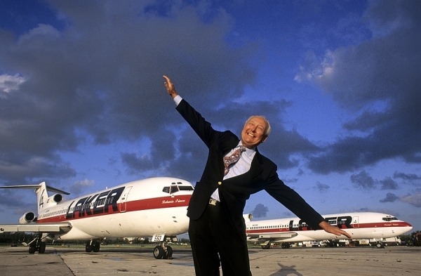 Sir Freddie Laker with two of his planes behind him at Ft. Lauderdale International Airport - who the Freddie Awards were named after