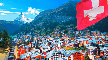 A Swiss flag overlooks the city of Geneva.