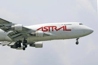 A photo of an Astral Aviation Cargo Airplane Flying