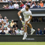 Emirates sponsorship behind Carlos Alcaraz (ESP) who serves against Frances Tiafoe (USA) in the third round of the Gentlemen's Singles on Centre Court at The Championships 2024